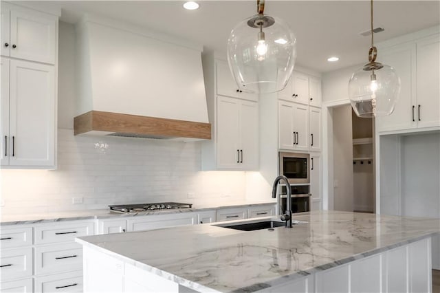 21513 W 80th Ter, Shawnee, KS 66220 - kitchen featuring appliances with stainless steel finishes, custom exhaust hood, white cabinetry, backsplash, and recessed lighting
