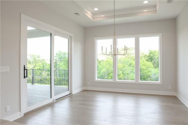 21513 W 80th Ter, Shawnee, KS 66220 - empty room featuring wood finished floors, a raised ceiling, and recessed lighting