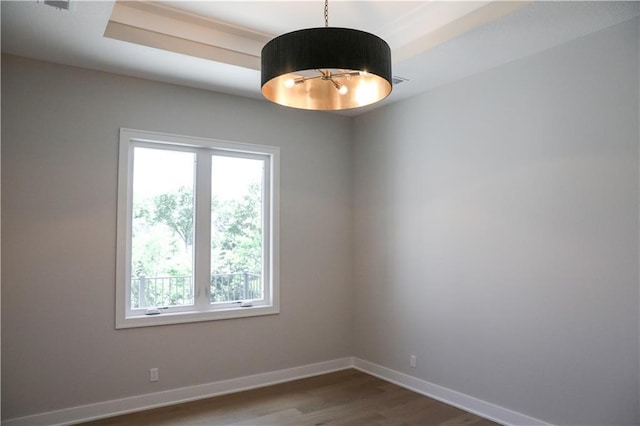 21513 W 80th Ter, Shawnee, KS 66220 - empty room featuring healthy amount of natural light and dark wood-style floors