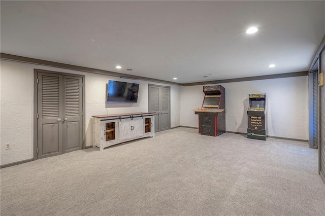 basement with crown molding and light colored carpet