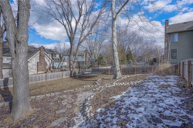 view of yard covered in snow