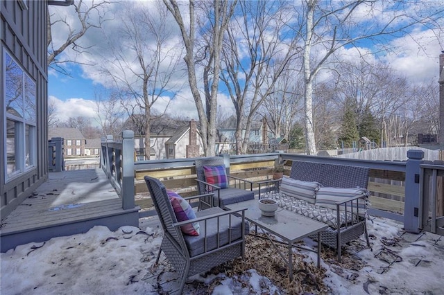 snow covered deck featuring outdoor lounge area