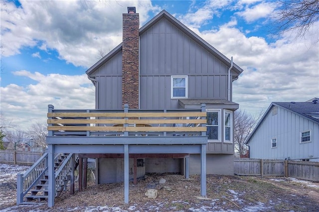 back of house featuring a wooden deck