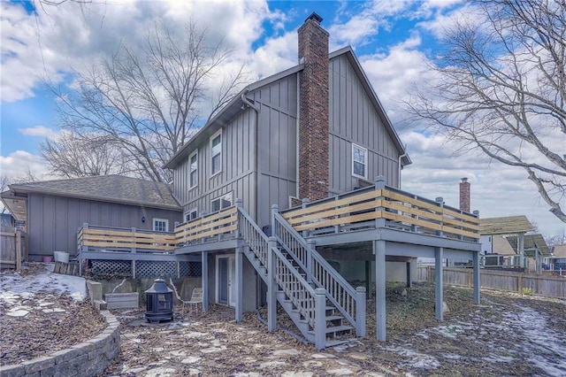 rear view of house featuring a deck