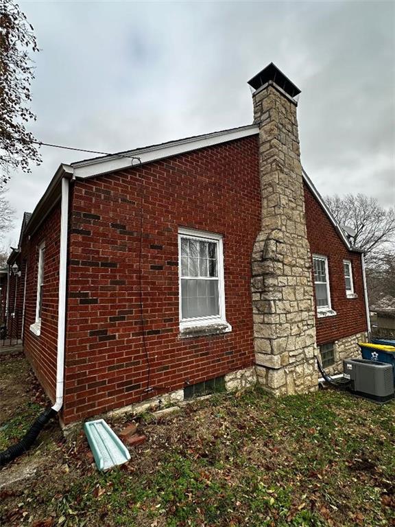 view of property exterior with cooling unit