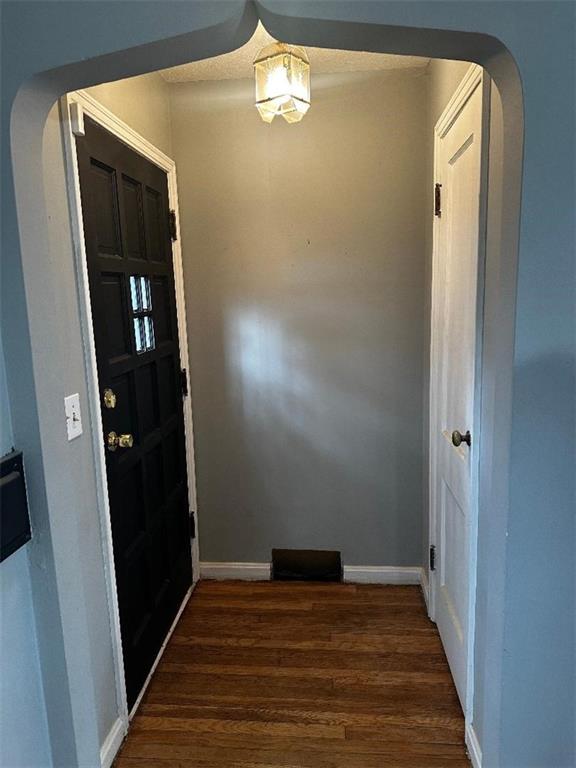 foyer entrance featuring dark hardwood / wood-style floors