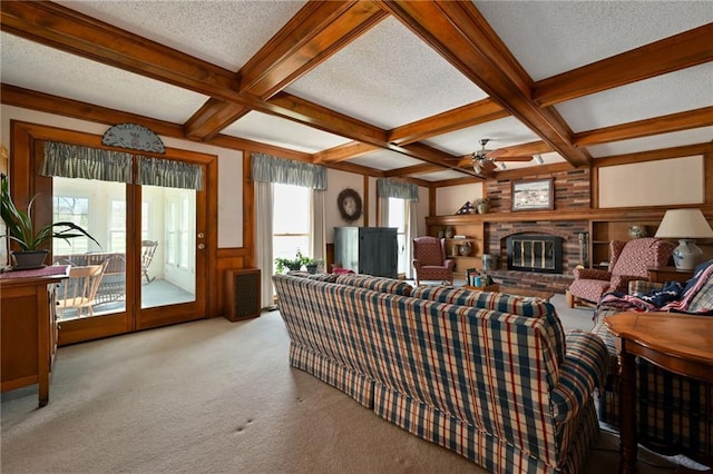 carpeted living room with beamed ceiling, a healthy amount of sunlight, and coffered ceiling