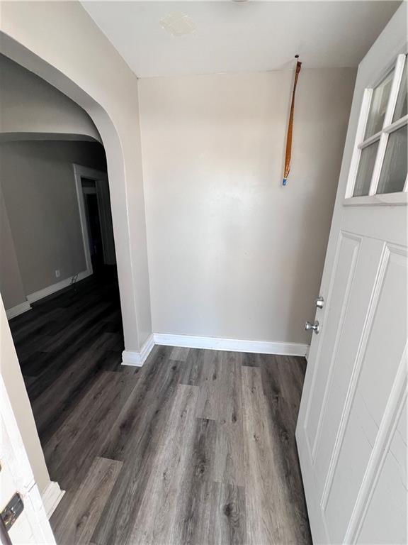 empty room featuring dark hardwood / wood-style flooring