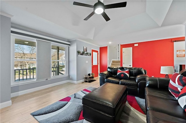 home theater room featuring crown molding, light hardwood / wood-style flooring, ceiling fan, and vaulted ceiling