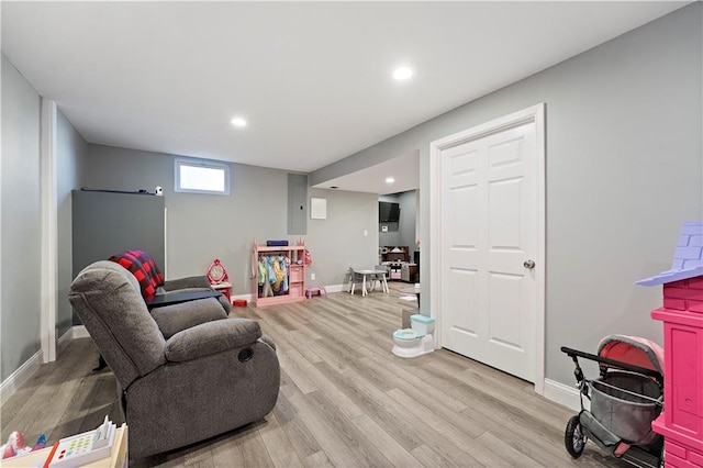 game room featuring light wood-type flooring