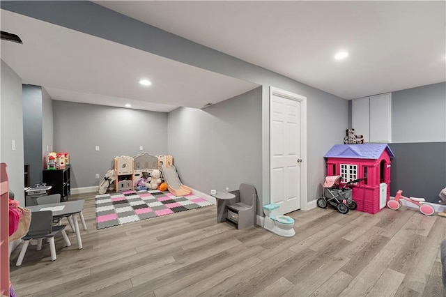 recreation room featuring light hardwood / wood-style flooring