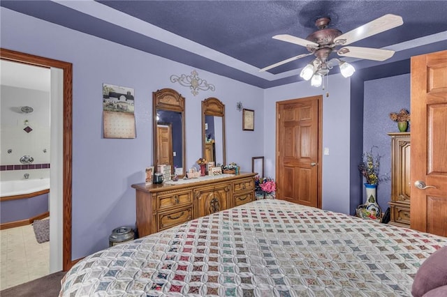 bedroom with ceiling fan and a textured ceiling