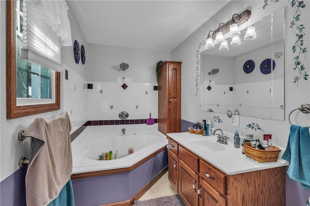 bathroom featuring a washtub and vanity