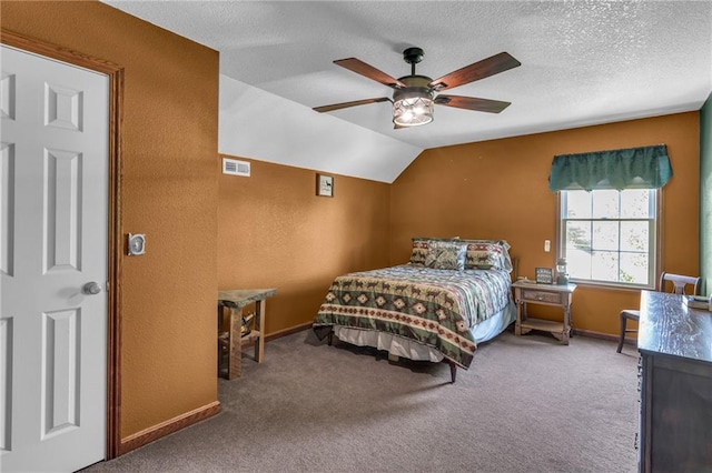 bedroom with a textured ceiling, carpet floors, vaulted ceiling, and ceiling fan