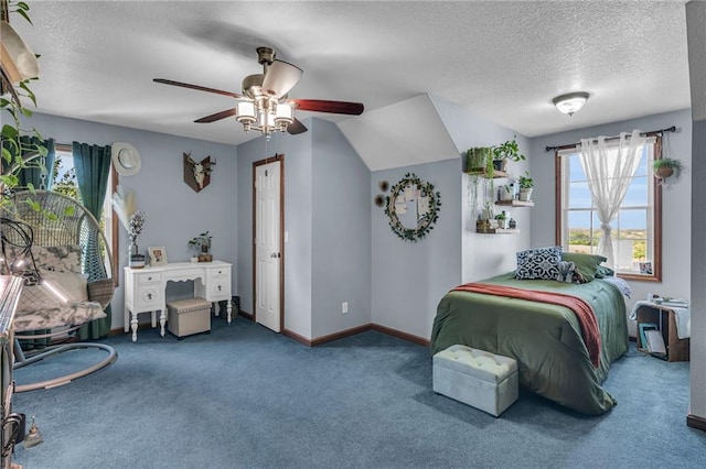 carpeted bedroom featuring ceiling fan, a textured ceiling, and vaulted ceiling