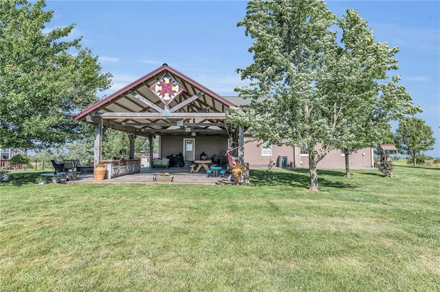 rear view of property with a lawn