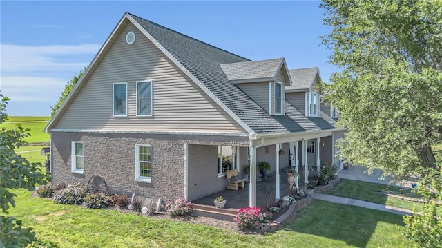 exterior space with a patio area and a yard