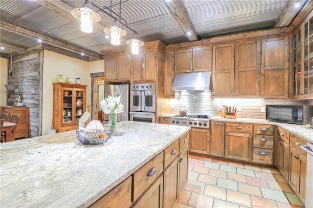 kitchen featuring hanging light fixtures, decorative backsplash, light stone countertops, beamed ceiling, and stainless steel appliances