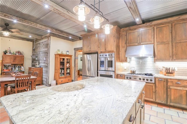 kitchen with beam ceiling, ceiling fan, a center island, pendant lighting, and appliances with stainless steel finishes