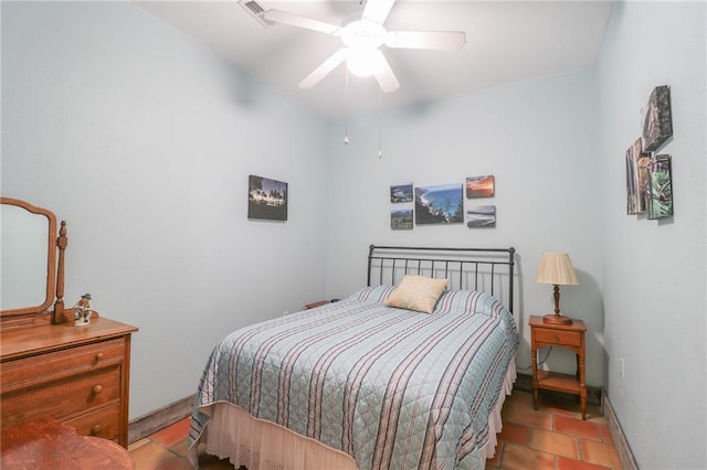 bedroom featuring light tile patterned floors and ceiling fan