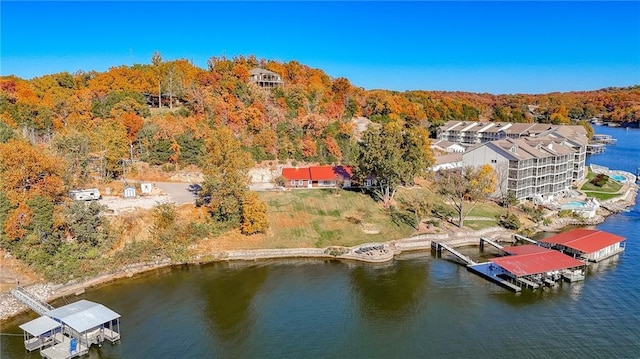 birds eye view of property with a water view