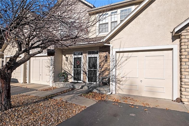 entrance to property featuring a garage