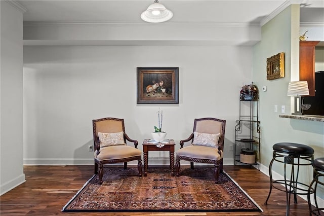 sitting room featuring dark hardwood / wood-style flooring and crown molding