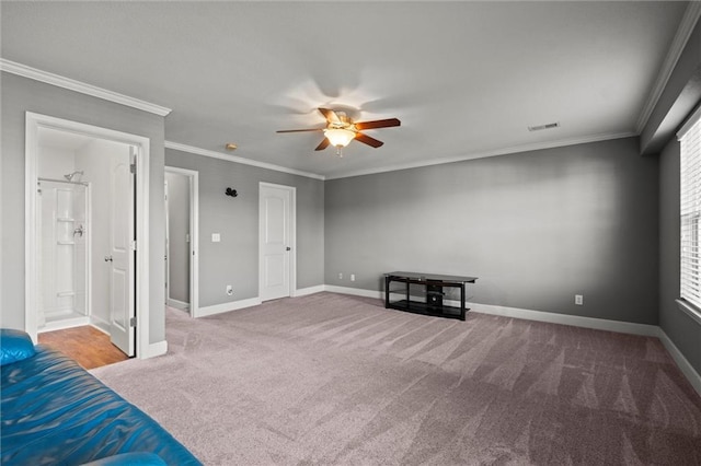 interior space with carpet flooring, crown molding, and ceiling fan