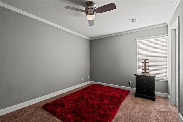 interior space featuring carpet flooring, ceiling fan, and ornamental molding