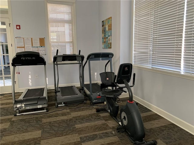 exercise room with dark carpet