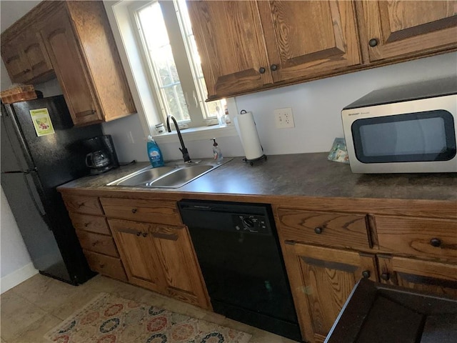 kitchen featuring black appliances and sink