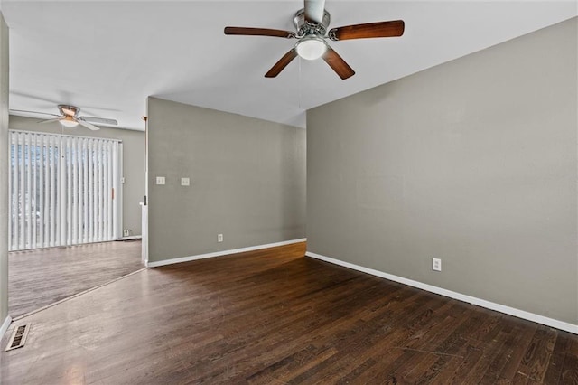 unfurnished living room featuring ceiling fan and dark hardwood / wood-style floors