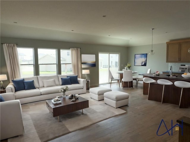 living room featuring a wealth of natural light and light wood finished floors