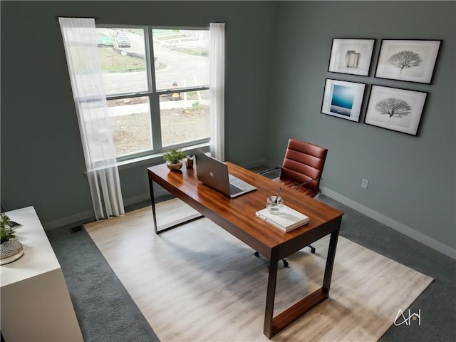 office area featuring visible vents and baseboards