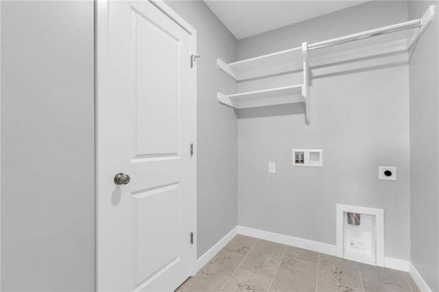 clothes washing area with laundry area, washer hookup, electric dryer hookup, and baseboards