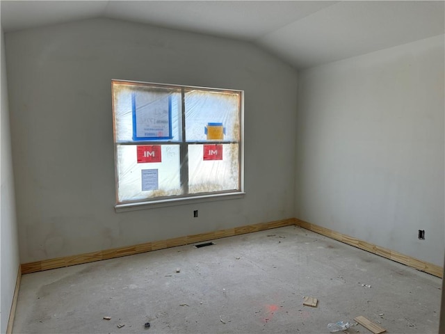 17756 Houston St, Gardner, KS 66030 - unfurnished room with lofted ceiling and baseboards