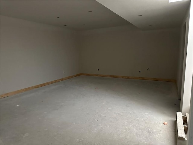 17756 Houston St, Gardner, KS 66030 - spare room featuring baseboards and concrete flooring