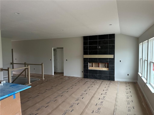 17756 Houston St, Gardner, KS 66030 - unfurnished living room with lofted ceiling and baseboards