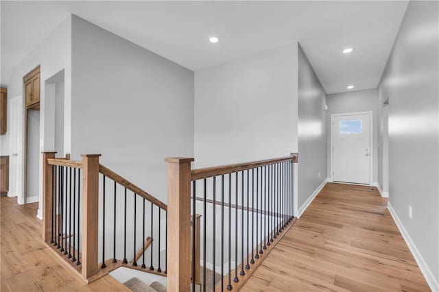 17756 Houston St, Gardner, KS 66030 - hallway featuring an upstairs landing, light wood-style floors, and recessed lighting