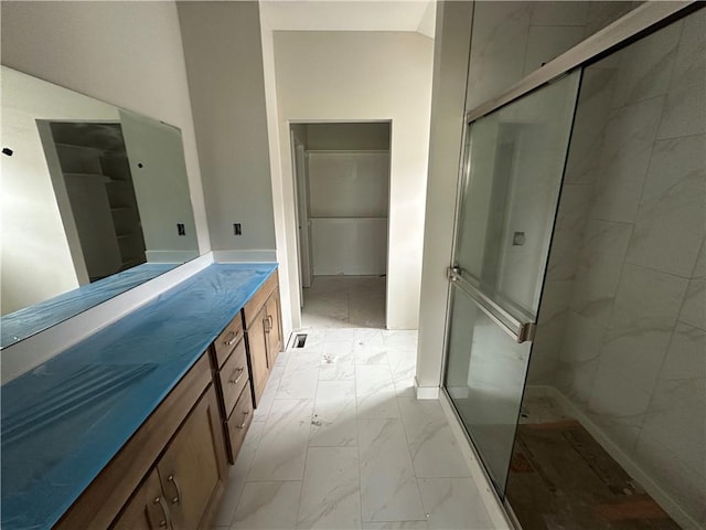 17756 Houston St, Gardner, KS 66030 - bathroom with marble finish flooring, a stall shower, and vanity