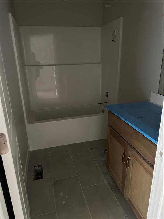 17756 Houston St, Gardner, KS 66030 - bathroom featuring vanity, shower / tub combination, and tile patterned flooring