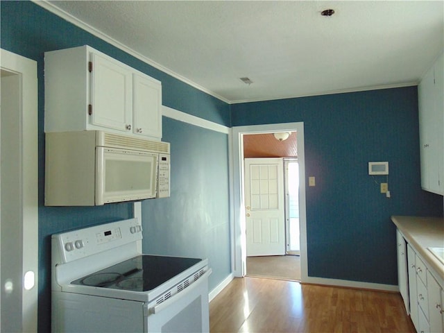 kitchen featuring white appliances, light hardwood / wood-style flooring, white cabinetry, and crown molding