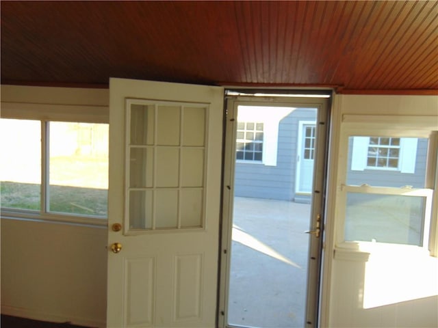 doorway to outside featuring wooden ceiling