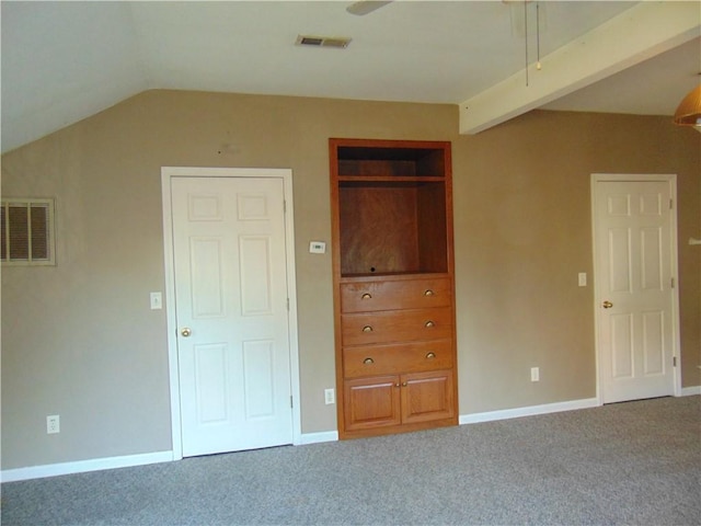 unfurnished bedroom featuring carpet floors and vaulted ceiling