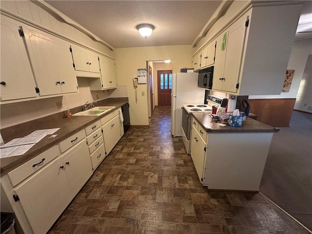 kitchen featuring sink, white cabinets, black appliances, and a textured ceiling