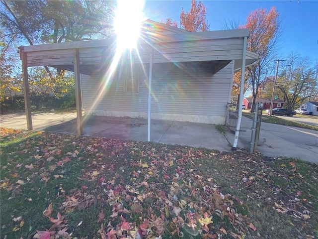 view of property exterior with a carport