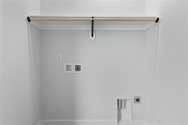 clothes washing area with hookup for a washing machine, laundry area, electric dryer hookup, and baseboards