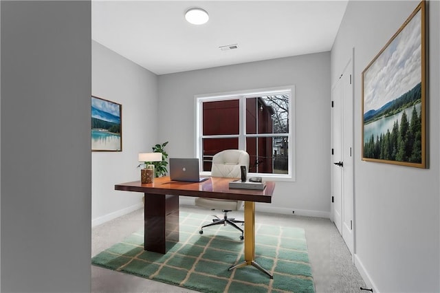 office area with light carpet, baseboards, and visible vents