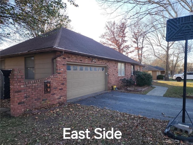 view of side of property with a garage