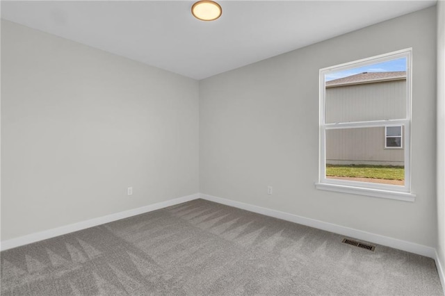 carpeted empty room featuring a healthy amount of sunlight